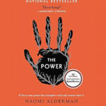 The cover of The Power by Naomi Alderman features a black handprint with branches extending from the fingers on an orange background. The title is in the center, and a review quote appears at the top.
