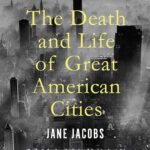 Book cover for The Death and Life of Great American Cities by Jane Jacobs, featuring yellow text over a black-and-white aerial view of New York City skyscrapers amidst fog.
