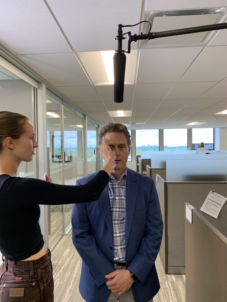 A woman touching a mans face.