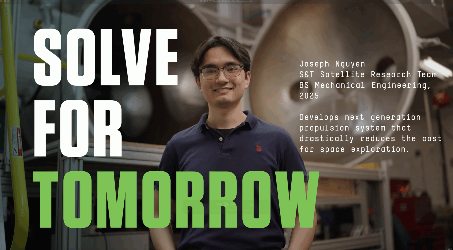 A young man wearing glasses and a dark shirt stands in a lab with industrial equipment behind him. Bold text reads “SOLVE FOR TOMORROW.” A caption describes his work on cost-reducing propulsion systems for space exploration.
