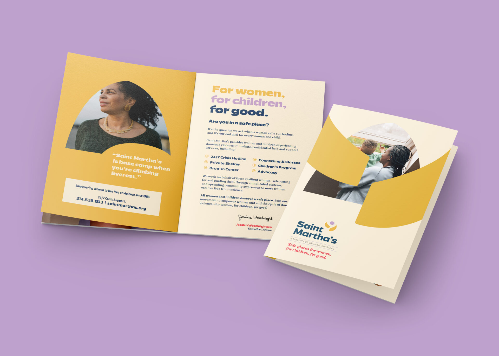An open folded brochure on a lavender surface. The brochure features a photo of a woman, contact info, bright yellow and cream colors, and text about services provided by Saint Martha’s for women and children.